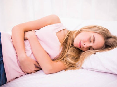 A women during period is sleeping with MALORY overnight sanitary pads protection
